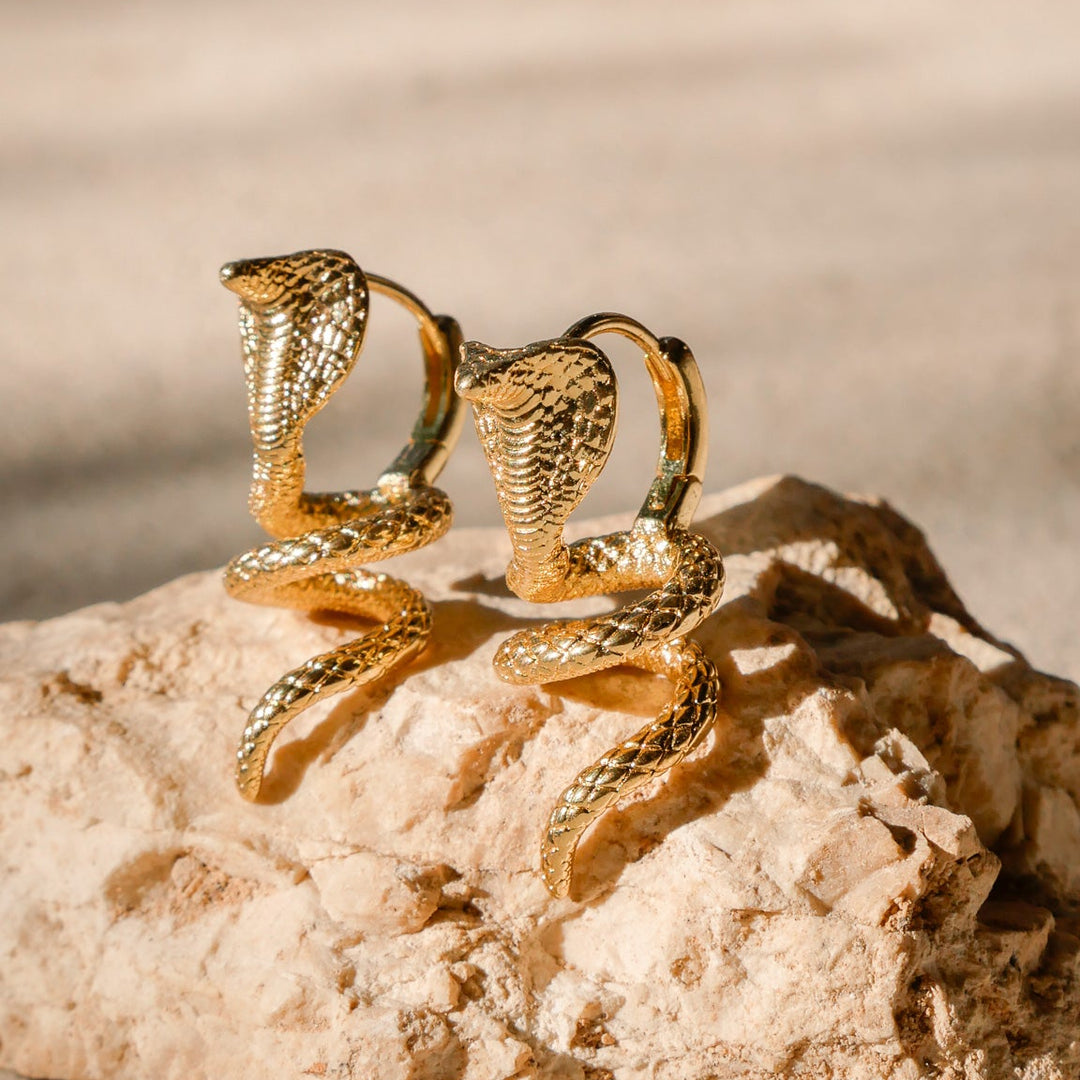 queen cobra statement earrings side 